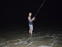 Санья на Хайнане с сетями у берега и слабой морской рыбалкой